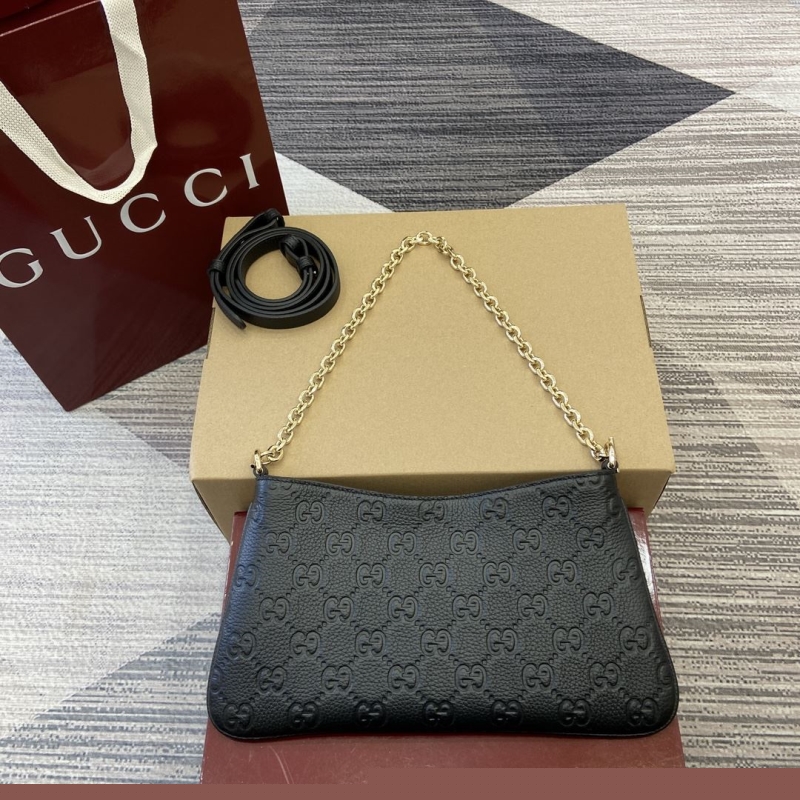 G*u*i top handle bags